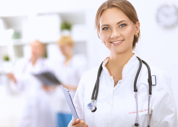 Woman in white coat and stethoscope
